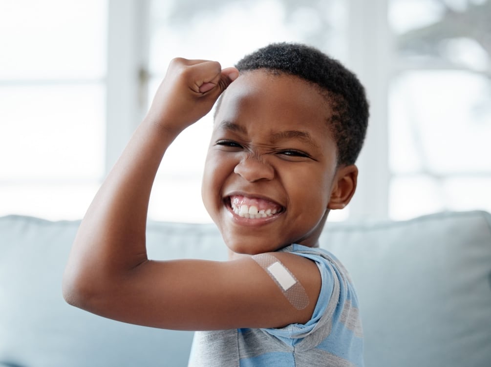Kid celebrating bravery in getting a needle